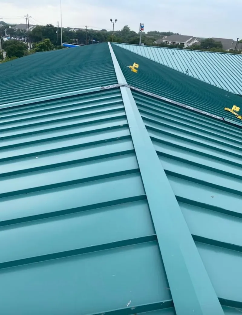 Green commercial metal roof ridge and valley for Metal Roof Repair in Crouch Mesa